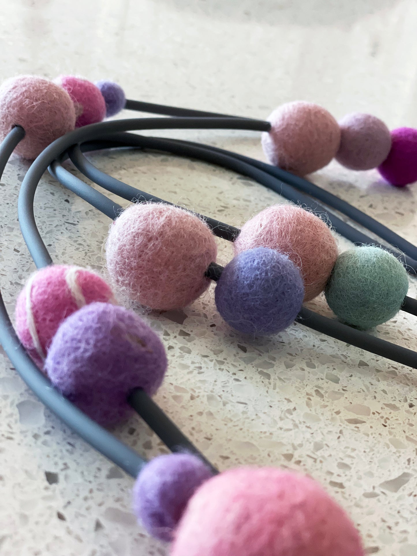 Modern Long Double Strand Gray Rubber Necklace With 15 Pink and Purple Wool Felt Balls