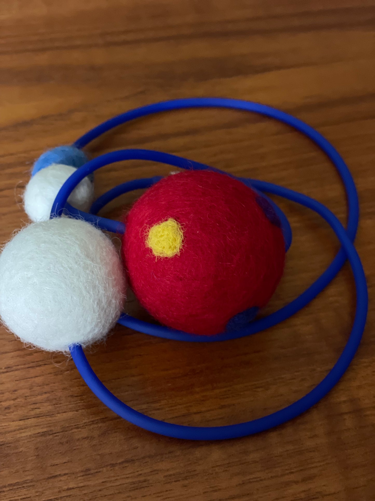 Modern Long Single Strand Blue Rubber Necklace With 4 Red/White/Blue Wool Felt Balls