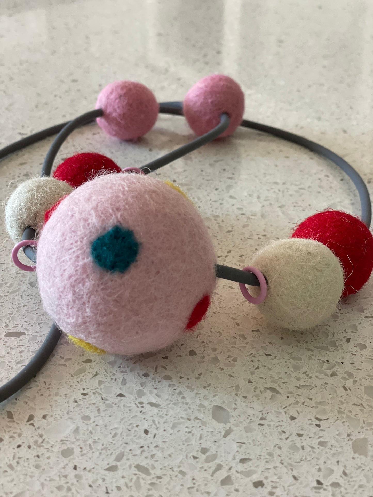 Modern Long Single Strand Gray Rubber Necklace With 7 Pink, Red & White Wool Felt Balls