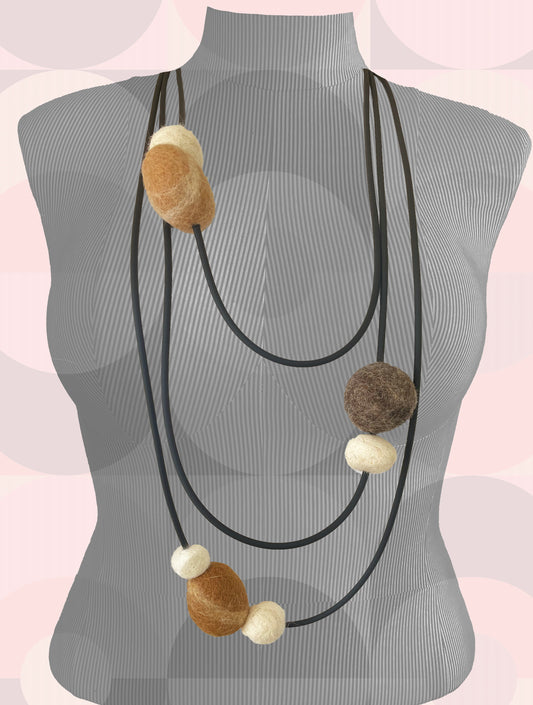 Modern Long Triple Strand Black Rubber Necklace With 7 Neutral-Color Wool Felt Balls