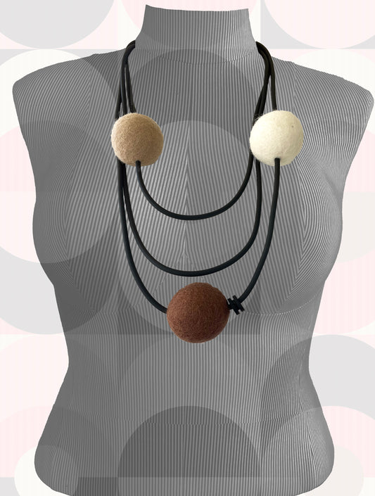 Modern Long Triple Strand Black Rubber Necklace With 3 Neutral-Color Wool Felt Balls